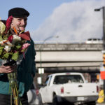 Homeless person, using flowers to make food happen